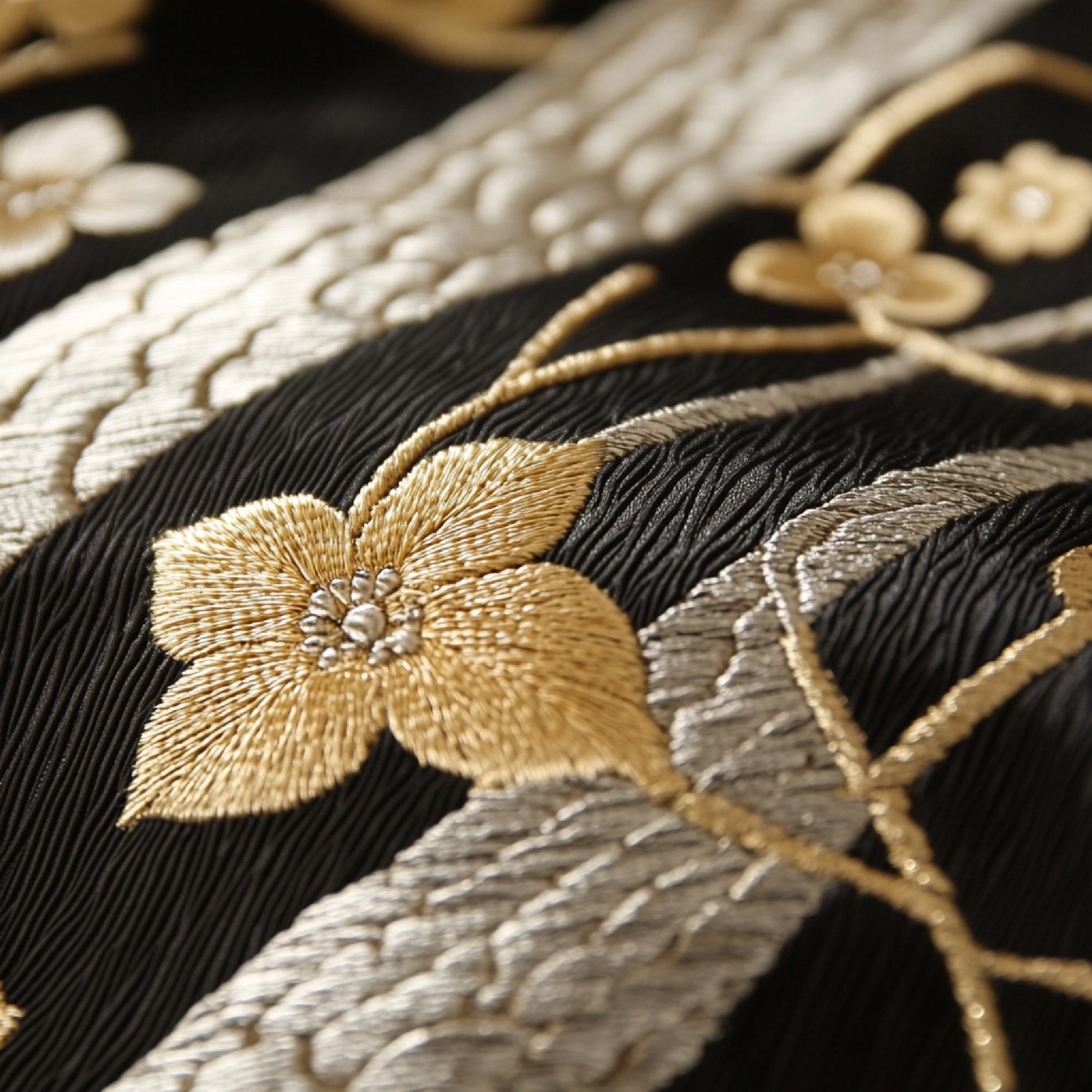Close-up of bespoke gold-thread embroidery on silk
